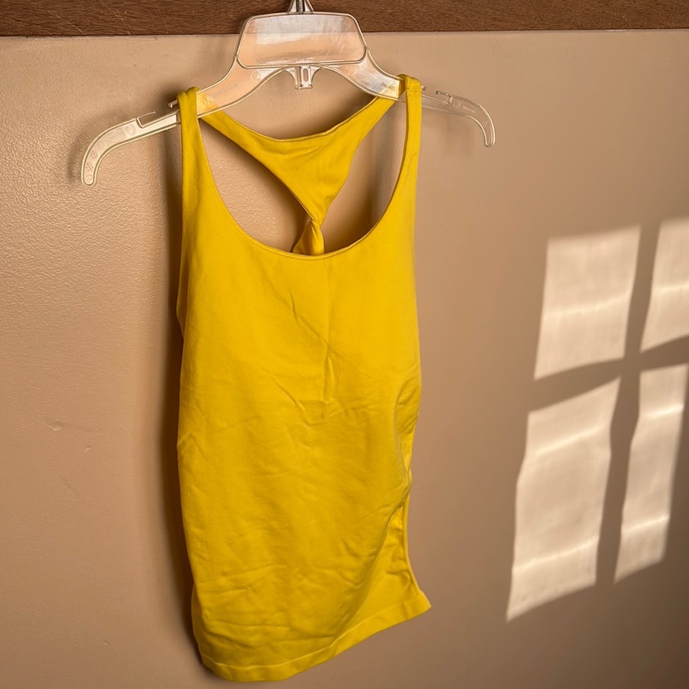 This Bebe top is built-in
shelf bra for a smooth looks
23” length size M/L